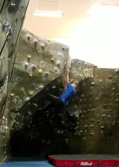 Daddy climbing at the gym