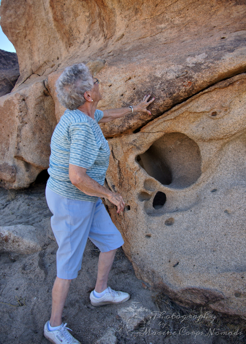 Grandma looking at rock