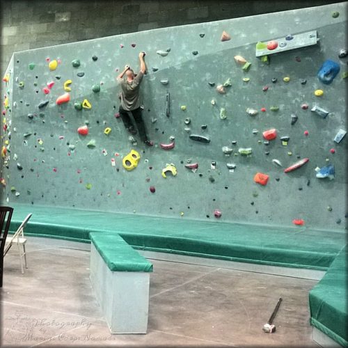 Testing out the holds at Desert Rocks Climbing Gym